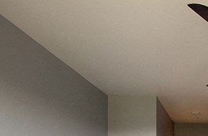 Reno Apartments for Rent - Bedroom with Carpet, Natural Light, Access to Bathroom, and a Ceiling Fan